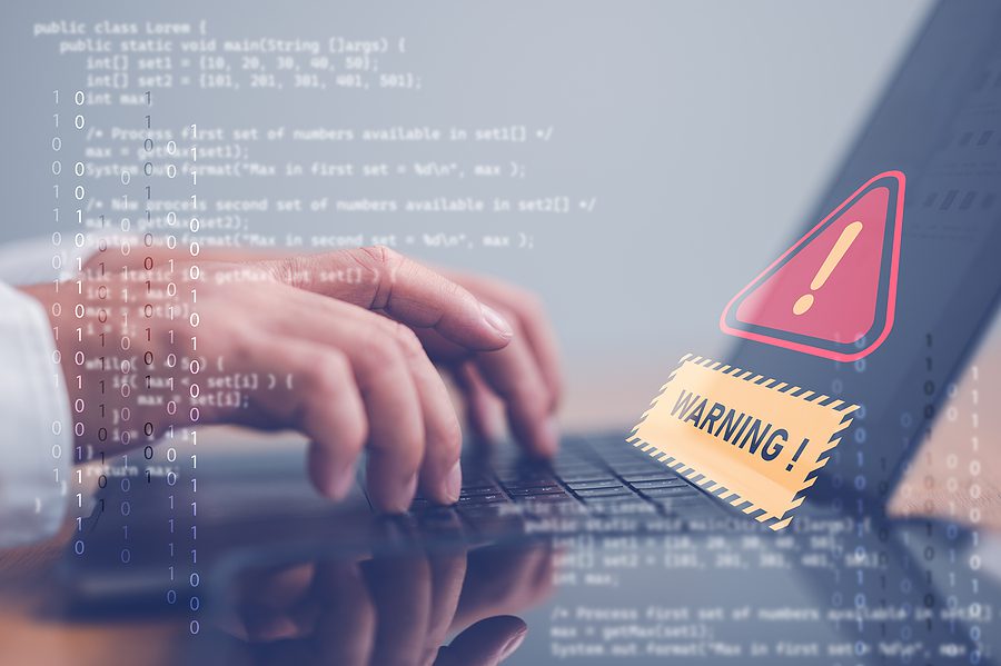 Laptop with box that says "warning" code along image borders
