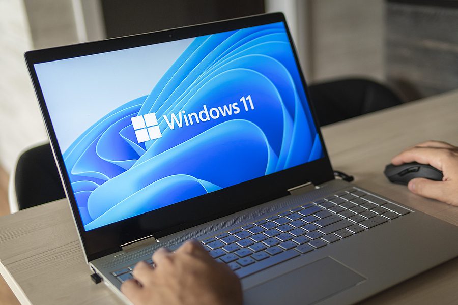 Closeup of an open laptop with Windows 11 on the screen. 