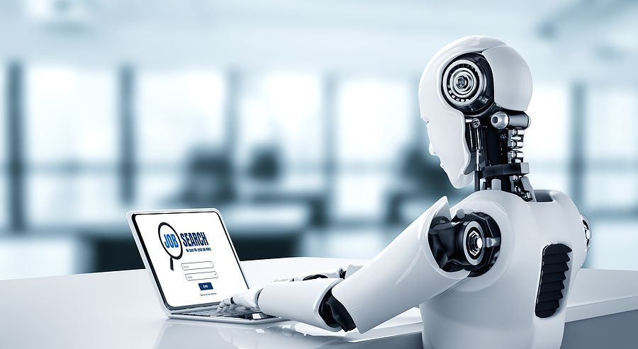Robot using laptop to search for jobs to demonstrate the concept of fake AI job applicants. 