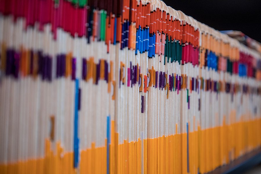 Closeup of a shelf full of medical charts. 
